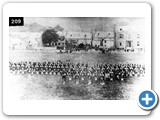 Fortrose Cathedral Green pre1900 Inspection of volunteers. Brass Band in front. Taen before he building of Provost Geddie's shop and house (now Co-op)